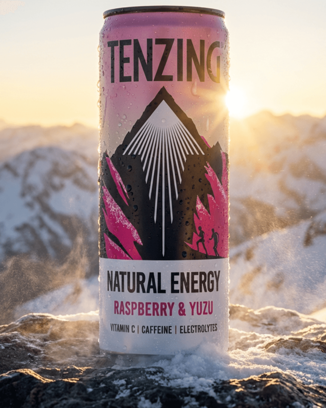 Tenzing Raspberry and Yuzu energy drink can on a snowy mountain peak at sunrise.